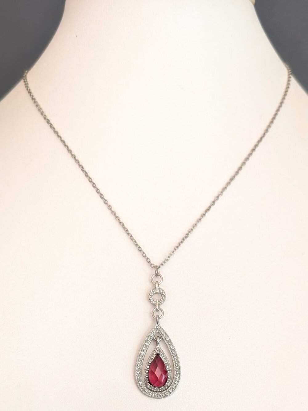 Silver double teardrop pendant with faceted stone